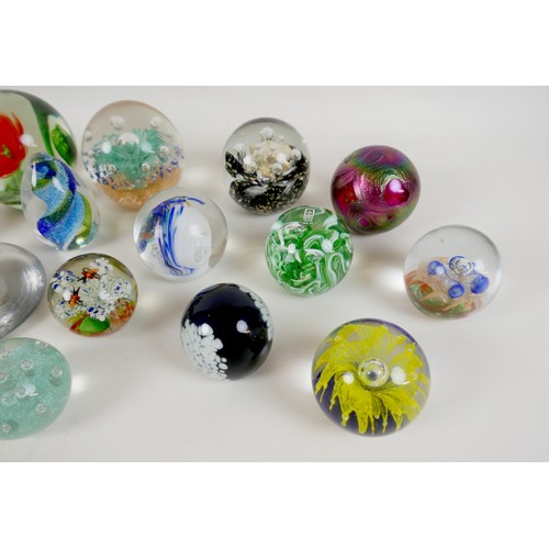 64 - A collection of modern glass paperweights, including Mdina, Malta - Phoenician, and one signed 'OG20... 