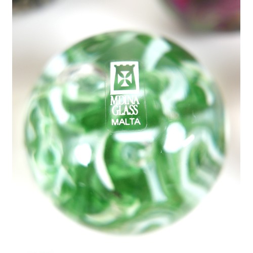 64 - A collection of modern glass paperweights, including Mdina, Malta - Phoenician, and one signed 'OG20... 