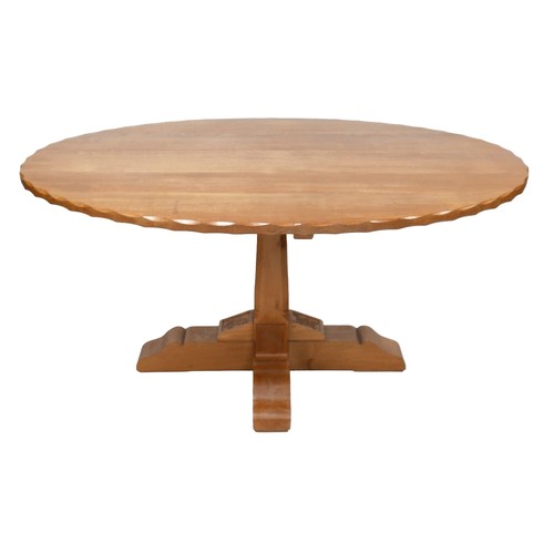 440 - A Wren Craftsman Sherwood oak oval dining table, with carved wren signature and carved decoration, 1... 