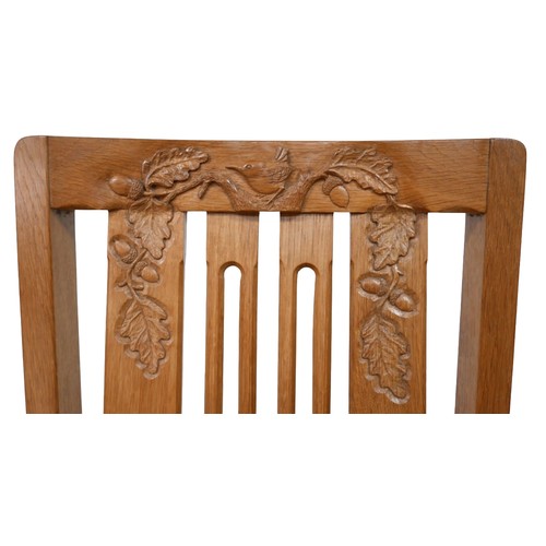 440 - A Wren Craftsman Sherwood oak oval dining table, with carved wren signature and carved decoration, 1... 