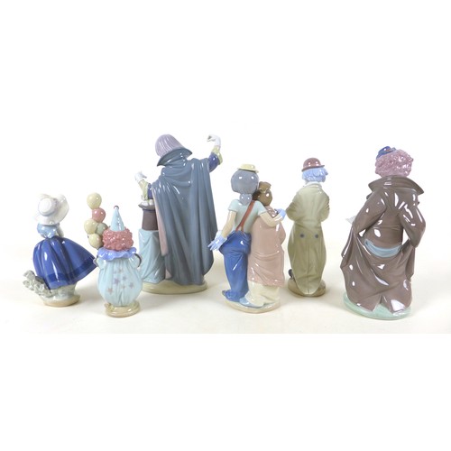 49 - A collection of six Lladro figurines, five modelled as clowns, one as a girl with a basket, together... 