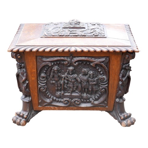 414 - A Victorian mahogany and oak wine cooler of sarcophagus form, with relief carved panels, raised upon... 