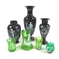 A group of Mary Gregory style vases and glassware, comprising three black glass vases, tallest 33.8c... 