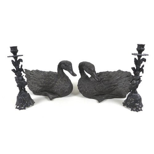 104 - A pair of 20th century cast resin duck sculptures, in resting positions, both approximately 30cm lon... 