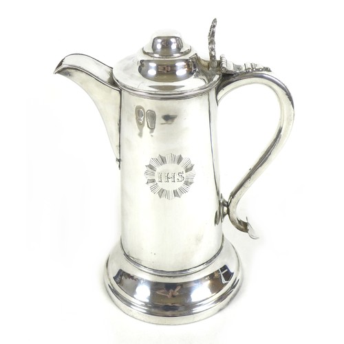 76 - A collection of silver plated wares, including a large Holy Communion wine flagon, engraved with 'IH... 