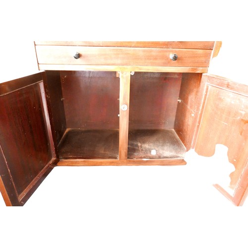 429 - A mid 20th century mahogany dentist's cabinet, with an upper section of twin glazed doors over an op... 