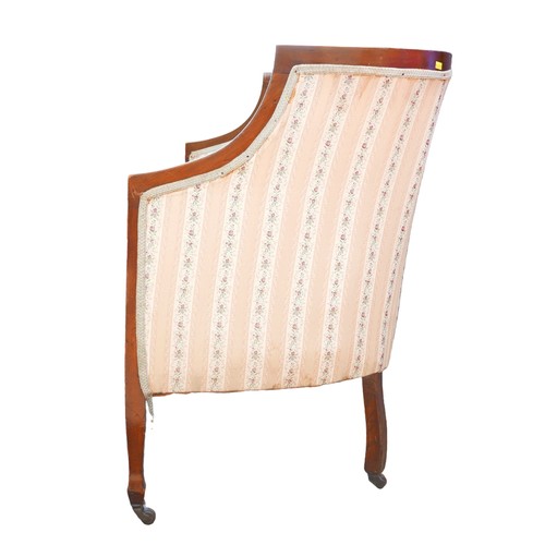 396 - An Edwardian mahogany two seater settee, overstuffed seat upholstered in striped floral fabric, rais... 