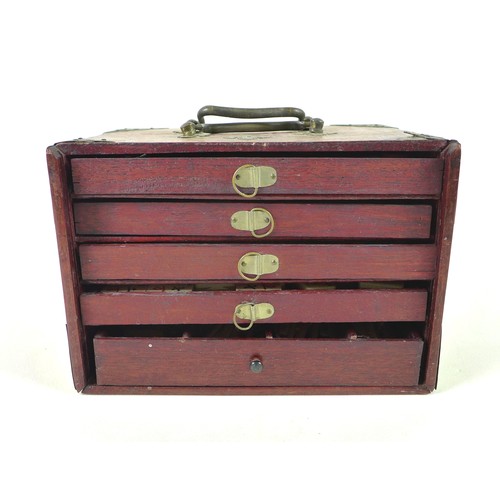 110 - An early 20th century Mahjong set, the case with slide front panel revealing five trays, filled with... 