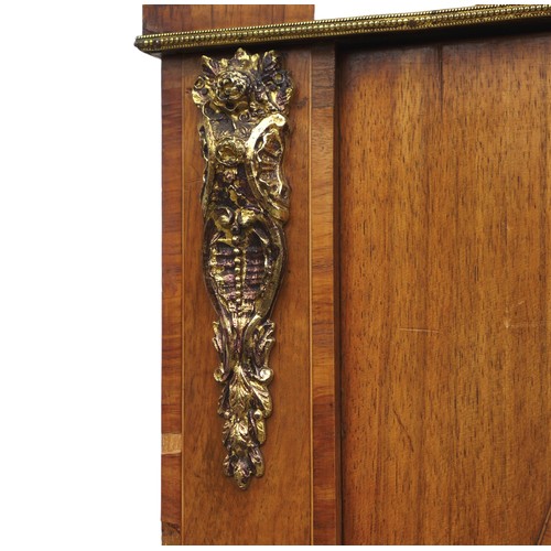 409 - A Victorian walnut veneered pier cabinet, gilt metal mounted, caddy top above two doors with oval gl... 