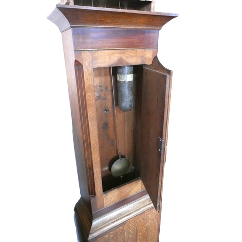 423 - A 18th century oak and mahogany long case clock, by Jonathan Overall of Ramsey, with broken pediment... 