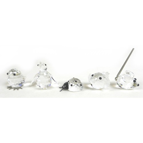 65 - A group of Swarovski crystal animal figurines, comprising an elephant, ladybird, a large puffer fish... 