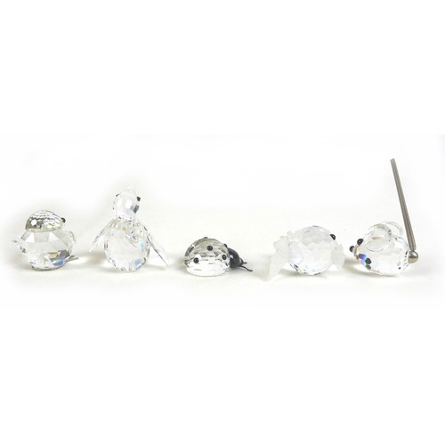 65 - A group of Swarovski crystal animal figurines, comprising an elephant, ladybird, a large puffer fish... 