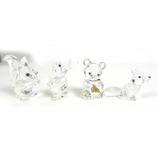 65 - A group of Swarovski crystal animal figurines, comprising an elephant, ladybird, a large puffer fish... 