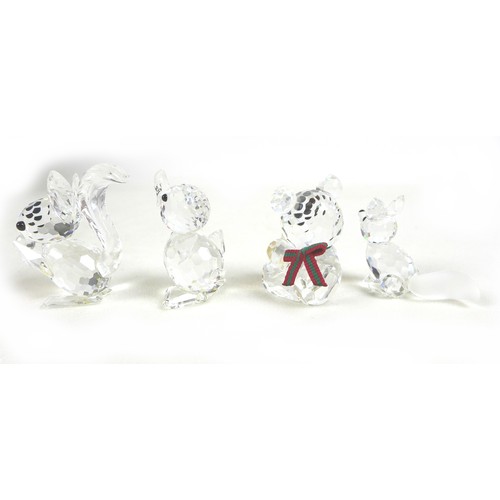 65 - A group of Swarovski crystal animal figurines, comprising an elephant, ladybird, a large puffer fish... 