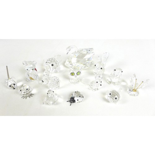 65 - A group of Swarovski crystal animal figurines, comprising an elephant, ladybird, a large puffer fish... 