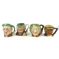 A group of four character jugs, modelled as Dickens' characters, tallest 18cm high. (4)