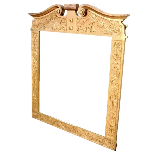 402 - An early to mid 20th century giltwood wall mirror, with broken swan neck pediment, neoclassical foli... 