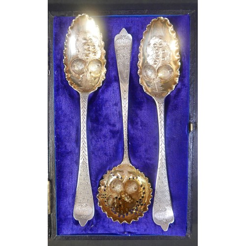 20 - A group of silver servicing spoons, comprising a set of two berry spoon and matching sugar sifter, a... 