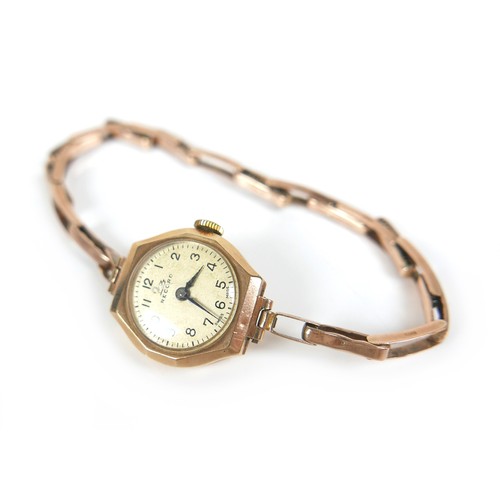 96 - A 9ct gold 'Record' lady's cocktail wristwatch, with Arabic dial, a 9ct gold octagonal case and gold... 