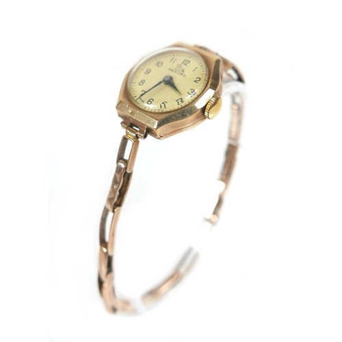 96 - A 9ct gold 'Record' lady's cocktail wristwatch, with Arabic dial, a 9ct gold octagonal case and gold... 