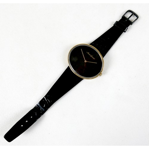 93 - A Maurice Guerdat gold plated lady's dress watch, minimalist oval black dial, gold hands, quartz mov... 