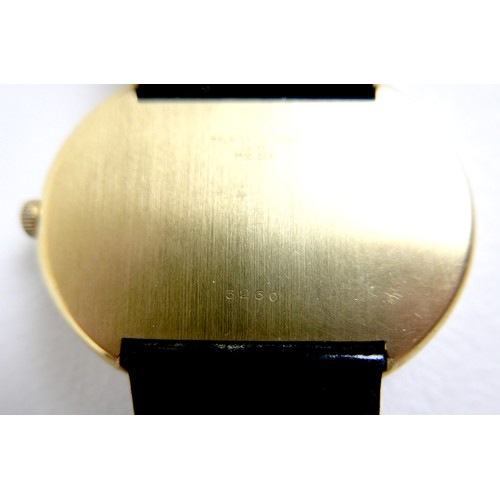 93 - A Maurice Guerdat gold plated lady's dress watch, minimalist oval black dial, gold hands, quartz mov... 