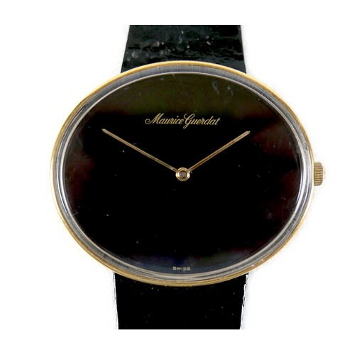 93 - A Maurice Guerdat gold plated lady's dress watch, minimalist oval black dial, gold hands, quartz mov... 