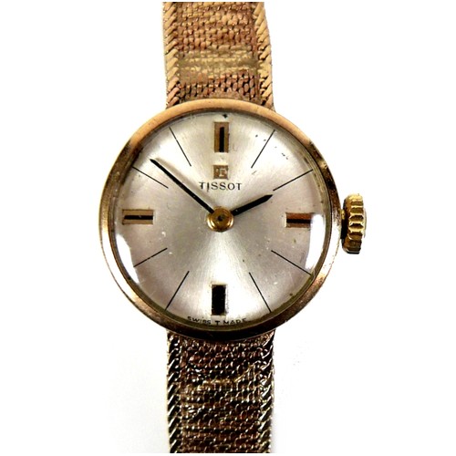 101 - A Tissot 9ct gold lady's wristwatch, circa 1966, with circular silvered dial, gold and black baton c... 