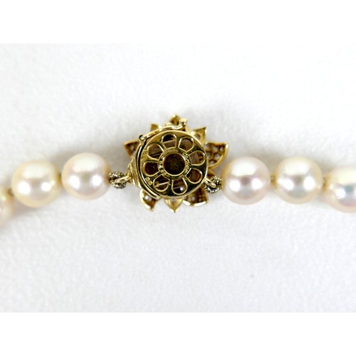 211 - A vintage Cartier pearl necklace with 18ct yellow gold and diamond set clasp, with single row of fif... 