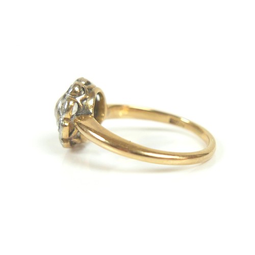 201 - An 18ct gold diamond daisy set ring, central stone approximately 5mm in diameter, surrounded by ten ... 