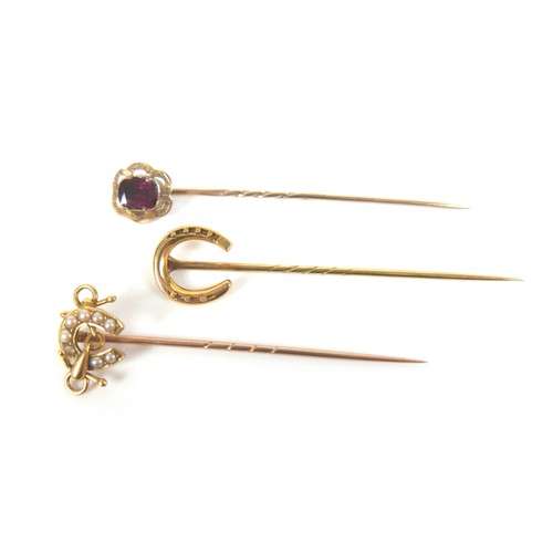 166 - An 18ct gold and seed pearl stick pin, 1.9g, 5.5cm long, together with a group of yellow metal items... 