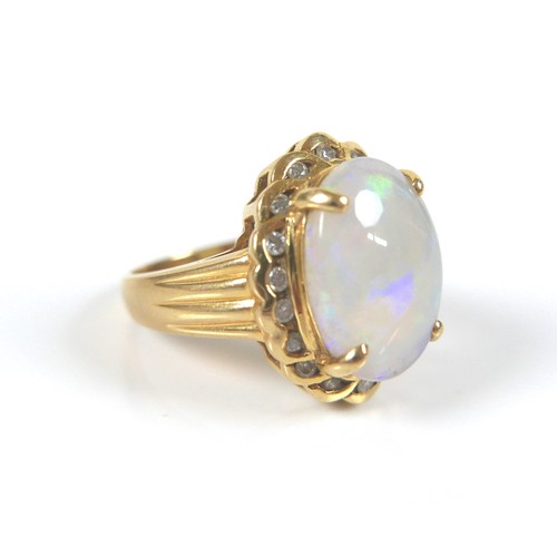 191 - An 18ct gold, opal and diamond dress ring, the central oval opal 1.6 by 1.2cm, surrounded by 18 bril... 