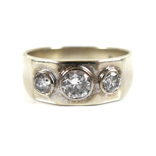 195 - A 9ct white gold and diamond three stone ring, the graduated stones brilliant cut and in rubover set... 