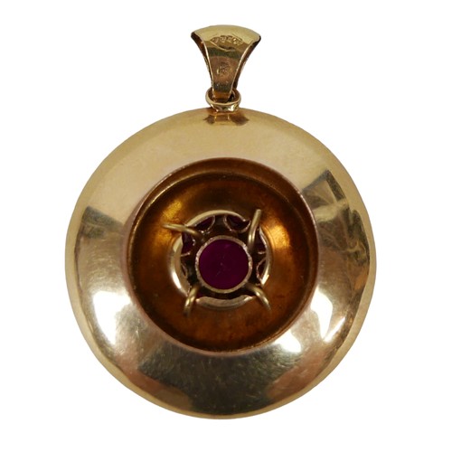 160 - An 18ct gold and ruby pendant, a circular setting with large round cut ruby, 6.8mm, surrounded by ni... 