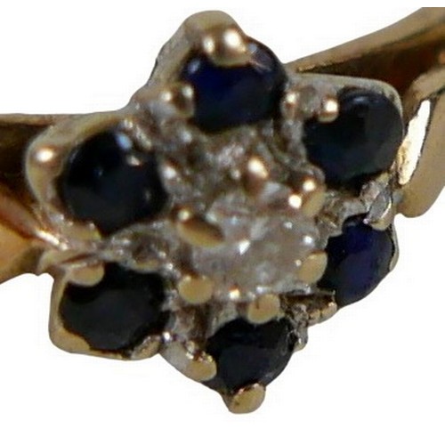 146 - A group of three gold dress rings, comprising a 14ct gold diamond and sapphire cross over ring, size... 