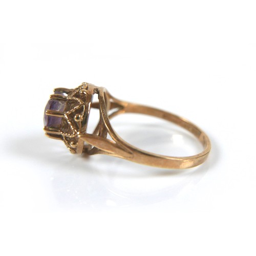 178 - Two 9ct gold dress rings, comprising an amethyst ring with open work crown setting, round cut stone,... 