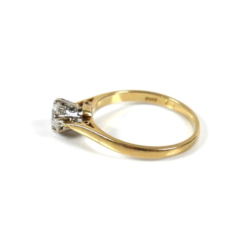 196 - An 18ct yellow gold and diamond solitaire ring, the round brilliant cut stone, 5.5 by 3.5mm, approxi... 