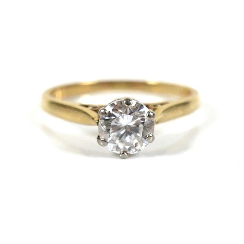 196 - An 18ct yellow gold and diamond solitaire ring, the round brilliant cut stone, 5.5 by 3.5mm, approxi... 