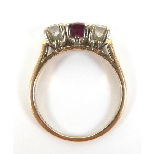 187 - A group of three gold rings, comprising a 14ct and 18ct gold diamond and ruby three stone ring, each... 