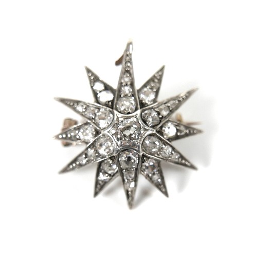 200 - A Victorian diamond set starburst brooch, the central diamond of approximately 0.22ct, 3.2mm, surrou... 