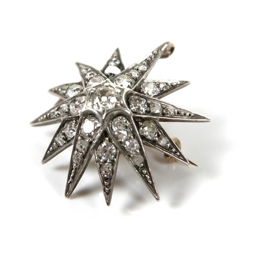 200 - A Victorian diamond set starburst brooch, the central diamond of approximately 0.22ct, 3.2mm, surrou... 