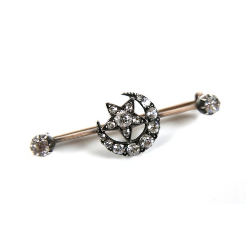 194 - A Victorian yellow gold and silver mounted diamond bar brooch, formed as a crescent moon and star, t... 