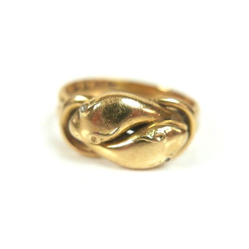 182 - An 18ct gold crossover serpent headed ring, size Q/R, 8.4g.