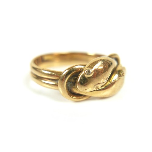 182 - An 18ct gold crossover serpent headed ring, size Q/R, 8.4g.