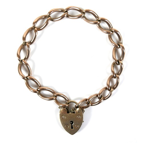 193 - A 9ct yellow gold curb link bracelet, with heart shaped padlock clasp and safety chain, 0.9 by 16cm ... 