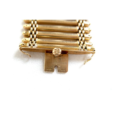 213 - An 18ct yellow gold bracelet, formed of forty-three parallel bars joined by bands of rounded brick l... 