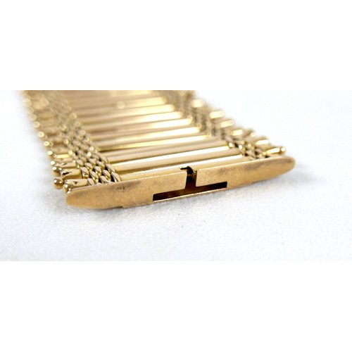 213 - An 18ct yellow gold bracelet, formed of forty-three parallel bars joined by bands of rounded brick l... 