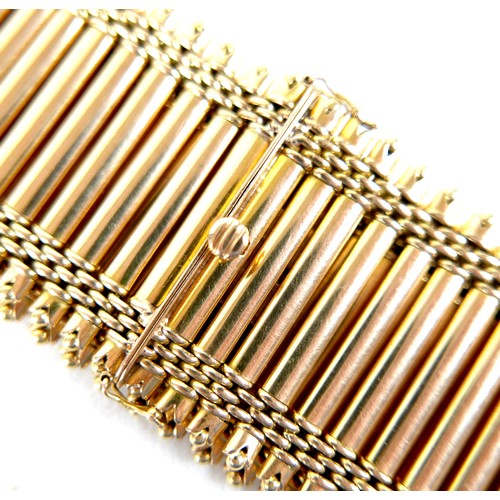 213 - An 18ct yellow gold bracelet, formed of forty-three parallel bars joined by bands of rounded brick l... 