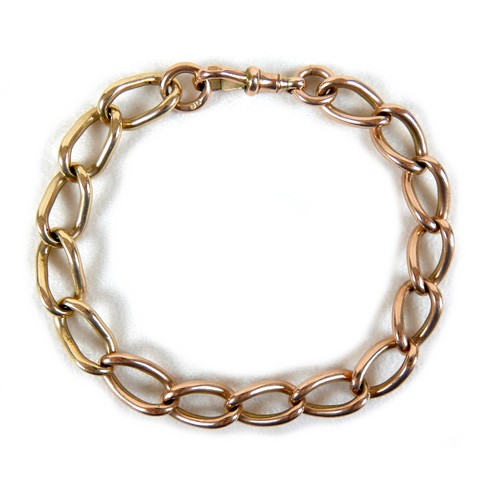 199 - A 9ct rose and yellow gold curb link bracelet, hallmarked to each link, 0.9 by 22cm long, 31.5g.