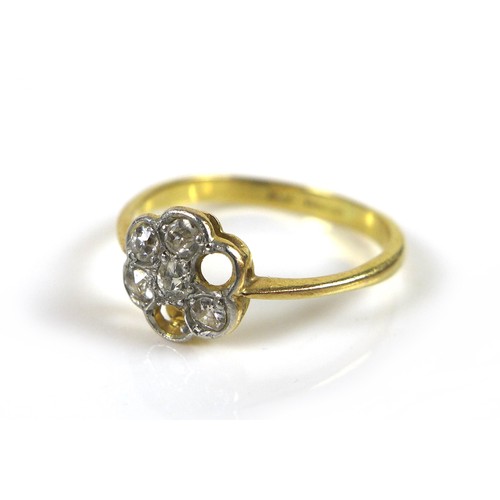 4 - An 18ct gold diamond daisy ring, missing two stones, each stone approximately 1.5mm diameter, size L... 